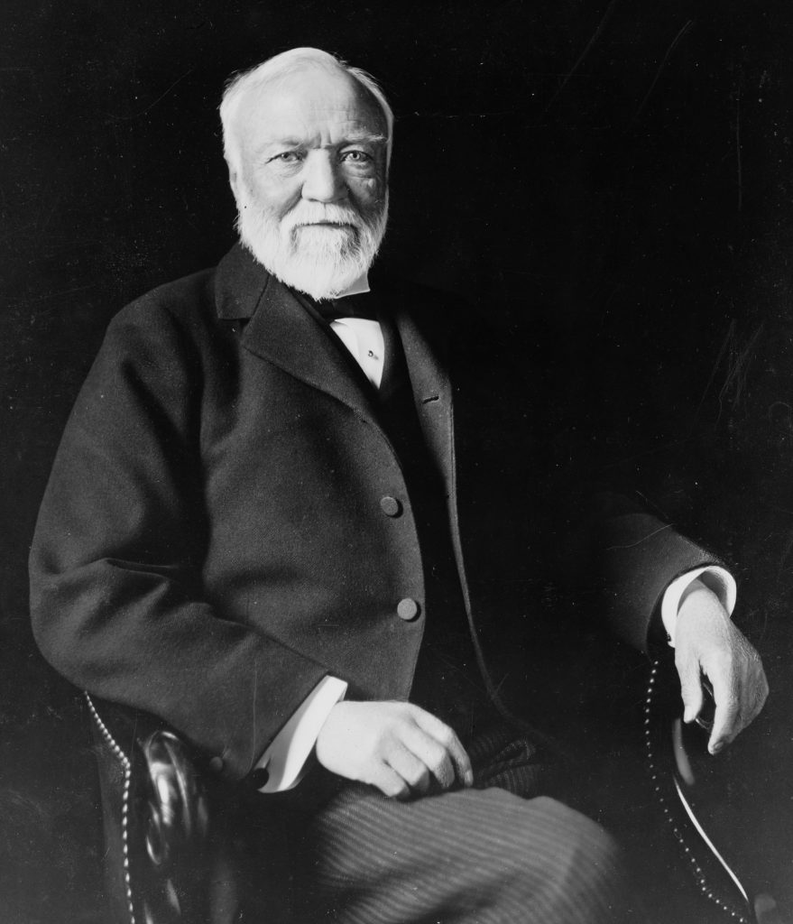 Andrew Carnegie sitting on a chair